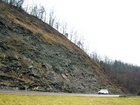 Algal mounds, ooid shoals, micrite ribbons, and shale at the base of the section in the roadcut along US Rt. 58 east of St Paul, Virginia. The outcrop exhibits an overall transgressive to regressive cycle (deepening & shoaling upward) in the Cambrian, Nolichucky Formation