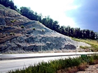 From the base up of this Kentucky Pound Gap Road Cut on Route 23 this exposure begins with the Devonian Ohio Shale, and the Bedford and Beria Sequences, the Mississippian the Sunbury Shale and Grainger Formation at the front of the Pine Mountain Thrust in the Appalachian Basin