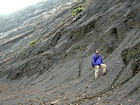 Low cloud over Pine Pound with the base of the visible portion this road cut marking the top the Lower Mississippian Sunbury Shale, here locally coffee colored. Above is of the Mississippian Grainger Formation and the top of the photograph just below the clouds is the overlying Lower Mississippian Newman Limestone Formation