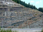 Pound Gap where the uppermost portion of the Mississippian Grainger Formation is here composed of alternating relatively continuous to occasionally shallowly channeled beds of sand with uniform sharp bedding planes and shale; both lithologies vary in thickness and the sands often exhibit Bouma sequences suggesting deposition from turbidite currents that were active over a mid to outer fan setting