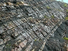 Pound Gap where an oblique photograph of the top the Lower Mississippian Sunbury Shale is in contact with the Mississippian Grainger Formation; here composed of sand and shale