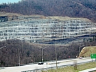 Most of the visible exposure is the Mississippian Newman Limestone. Above is the Pennington Formation and below the Grainger Formation in this Kentucky Pound Gap Road Cut on Route 23 at the front of the Pine Mountain Thrust in the Appalachian Basin