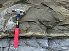 Contact between top 113 and bottom of 112 from the measured of the Geological Section of the Kentucky Geological Survey from their 1998 Field Trip Guide. Dolomitized silt layer in the Lower Mississippian Newman Limestone Formation just above a high energy laminated ooid layer. An outcrop picture from Pound Gap in Kentucky