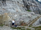 The center of the photograph is unit 111 of the Kentucky Geological Survey measured section from 1998 field trip. The unit is part of the Lower Mississippian Newman Limestone Formation, is 17 feet thick, is a mudstone at its base that shoals up to oolitic grainstone with an upper surface of a tan shaley dolomitic limestone. This micritic unit is cross bedded and/or channeled just above a low energy micritic horizon (location of Figures 134 and 135)