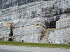 Lower tan/dark layer is top of unit 110 and base of unit 109, see the measured Geological Section, Kentucky Geological Survey Field Trip Guide 1998. Storm wave base is giving these shallow water limestones of the Lower Mississippian Newman Limestone Formation their irregular fill character in conjunction with low angle cross beds or mound margin clinoforms indicating migrating carbonate bodies moving in this setting. Note the two prominent dolomitized silts