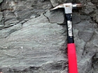 Interbedded intraclastic packstone and mudstone fabric of the Lower Mississippian Newman Limestone Formation. These sediments probably accumulated where storm wave erosion occurred just seaward of the shoreface, with waves driving local transport of this sediments across this shelf surface and caused the local irregular eroded character of the bedding planes. This is unit 101 of the measured Geological Section, Kentucky Geological Survey Field Trip Guide, 1998