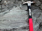 Interbedded intraclastic packstone and mudstone fabric of the Lower Mississippian Newman Limestone Formation. These sediments probably accumulated where storm wave erosion occurred just seaward of the shoreface, with waves driving local transport of this sediments across this shelf surface and caused the local irregular eroded character of the bedding planes. This is unit 101 of the measured Geological Section, Kentucky Geological Survey Field Trip Guide, 1998