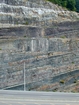 Pound Gap and a view of the eroded contact between the interbedded sands and shales of the Mississippian Grainger (most of which is exposed in this photograph) and the overlying Lower Mississippian Newman Limestone Formation. Note the chocolate colored dolomite horizon just above the contact