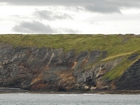 Exposures of Upper Clare Shale overlain by Ross Formation in the cliffs west of Bromore West and Drom in Co Kerry. These Namurian outcrops are south of Kilconly best seen from the Shannon Estuary. The shales evolve upward in depositional setting from a deeper euxinic setting with an influx of shales that upward change to turbiditic sands (Rider, 1969, and Martinsen, 1989).