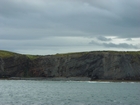 Exposures of Upper Clare Shale overlain by Ross Formation in the cliffs west of Bromore West and Drom in Co Kerry. These Namurian outcrops are south of Kilconly best seen from the Shannon Estuary. The shales evolve upward in depositional setting from a deeper euxinic setting with an influx of shales that upward change to turbiditic sands (Rider, 1969, and Martinsen, 1989).