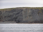 Exposures of Upper Clare Shale overlain by Ross Formation in the cliffs west of Bromore West and Drom in Co Kerry. These Namurian outcrops are south of Kilconly best seen from the Shannon Estuary. The shales evolve upward in depositional setting from a deeper euxinic setting with an influx of shales that upward change to turbiditic sands (Rider, 1969, and Martinsen, 1989).