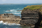 Exposures of Ross Formation in the cliffs at Leck Point in vicinity of the ruins of the Castle west and south of Drom in Co Kerry (Pyles, 2007). These Namurian outcrops turbiditic sands can be accessed by road and across the cow pastures at Drom.