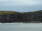Exposures of Lower to Middle Ross Formation in the cliffs west and south of Drom in Co Kerry. These Namurian outcrops are south of Kilconly best seen from the Shannon Estuary. The depositional setting is expressed by the turbiditic sands of the cliffs(Rider, 1969, Martinsen, 1989; and Pyles, 2007).