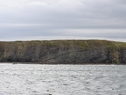 Exposures of Lower to Middle Ross Formation in the cliffs west and south of Drom in Co Kerry. These Namurian outcrops are south of Kilconly best seen from the Shannon Estuary. The depositional setting is expressed by the turbiditic sands of the cliffs(Rider, 1969, Martinsen, 1989; and Pyles, 2007).