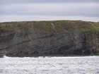 Exposures of Lower to Middle Ross Formation in the cliffs west and south of Drom in Co Kerry. These Namurian outcrops are south of Kilconly best seen from the Shannon Estuary. The depositional setting is expressed by the turbiditic sands of the cliffs(Rider, 1969, Martinsen, 1989; and Pyles, 2007).