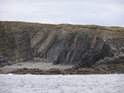 Exposures of Ross Formation in the cliffs west and south of Drom in Co Kerry. These Namurian outcrops turbiditic sands extend south east from the ruined Castle at Leck Point and are best seen from the Shannon Estuary (Rider, 1969, Martinsen, 1989; and Pyles, 2007).