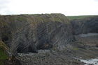 Exposures of Ross Formation in cliffs at Leck Point with its ruined Castle west and south of Drom in Co Kerry (Pyles, 2007). These Namurian outcrops of turbiditic sands are accessed by road and then a gulley to the beach through the cow pastures at Drom.