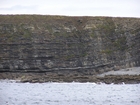 Exposures of Ross Formation in the cliffs west and south of Drom in Co Kerry. These Namurian outcrops turbiditic sands extend south east from the ruined Castle at Leck Point and are best seen from the Shannon Estuary (Rider, 1969, Martinsen, 1989; and Pyles, 2007).