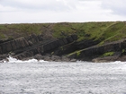 Exposures of Ross Formation in the cliffs northwest of Drom in Co Kerry. These Namurian outcrops turbiditic sands extend northwest from the ruined Castle at Leck Point and are best seen from the Shannon Estuary (Rider, 1969, Martinsen, 1989; and Pyles, 2007).