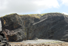 Exposures of Ross Formation in cliffs at Leck Point with its ruined Castle west and south of Drom in Co Kerry (Pyles, 2007). These Namurian outcrops of turbiditic sands are accessed by road and then a gulley to the beach through the cow pastures at Drom.