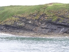 Exposures of Ross Formation in the cliffs northwest of Drom in Co Kerry. These Namurian outcrops turbiditic sands extend northwest from the ruined Castle at Leck Point and are best seen from the Shannon Estuary (Rider, 1969, Martinsen, 1989; and Pyles, 2007).