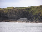 Exposures of Ross Formation in the cliffs northwest of Drom in Co Kerry. These Namurian outcrops turbiditic sands extend northwest from the ruined Castle at Leck Point and are best seen from the Shannon Estuary (Rider, 1969, Martinsen, 1989; and Pyles, 2007).