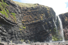 Exposures of Ross Formation in cliffs at Leck Point with its ruined Castle west and south of Drom in Co Kerry (Pyles, 2007). These Namurian outcrops of turbiditic sands are accessed by road and then a gulley to the beach through the cow pastures at Drom.