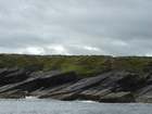 Exposures of Ross Formation in the cliffs northwest of Drom in Co Kerry. These Namurian outcrops turbiditic sands extend northwest from the ruined Castle at Leck Point and are best seen from the Shannon Estuary (Rider, 1969, Martinsen, 1989; and Pyles, 2007).