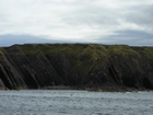 Exposures of Ross Formation in the cliffs northwest of Drom in Co Kerry. These Namurian outcrops turbiditic sands extend northwest from the ruined Castle at Leck Point and are best seen from the Shannon Estuary (Rider, 1969, Martinsen, 1989; and Pyles, 2007).