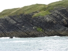 Exposures of Ross Formation in the cliffs northwest of Drom in Co Kerry. These Namurian outcrops turbiditic sands extend northwest from the ruined Castle at Leck Point and are best seen from the Shannon Estuary (Rider, 1969, Martinsen, 1989; and Pyles, 2007).