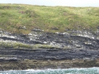 Exposures of Ross Formation in the cliffs northwest of Drom in Co Kerry. These Namurian outcrops turbiditic sands extend northwest from the ruined Castle at Leck Point and are best seen from the Shannon Estuary (Rider, 1969, Martinsen, 1989; and Pyles, 2007).