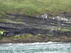 Exposures of Ross Formation in the cliffs northwest of Drom in Co Kerry. These Namurian outcrops turbiditic sands extend northwest from the ruined Castle at Leck Point and are best seen from the Shannon Estuary (Rider, 1969, Martinsen, 1989; and Pyles, 2007).