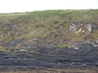 Exposures of Ross Formation in the cliffs northwest of Drom in Co Kerry. These Namurian outcrops turbiditic sands extend northwest from the ruined Castle at Leck Point and are best seen from the Shannon Estuary (Rider, 1969, Martinsen, 1989; and Pyles, 2007).