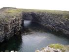 Upper Carboniferous Ross Sandstone formation eroded by wave action to leave a standing arch of sand or 