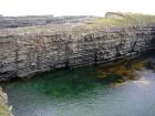 Upper Carboniferous Ross Sandstone formation eroded by wave action to leave a standing arch of sand or 