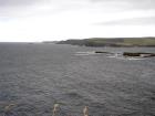 Namurian cliffs of deltaic sediments of the Tullig Formation form George's Head, in the background north of Kilkee Bay, Co. Clare.