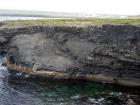 Mud Diapir in deltaic sediments of the Namurian Tullig Formation in foreground just south of Kilkee Bay. Cliffs marking the north side of Kilkee Bay in background.