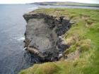 Mud Diapir in deltaic sediments of the Namurian Tullig Formation in foreground just south of Kilkee Bay. Cliffs marking the Georges Head
in background.