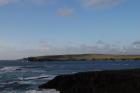 Namurian cliffs of deltaic sediments of the Tullig Formation form George's Head, in the background north of Kilkee Bay, Co. Clare. Forground is Diamond Head Rocks southwest of Kilkee at Knockroe, Co. Clare.