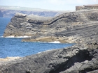 Fisherman's Point exposing Namurian deepwater sediments. Note the cut and fill of channeled Ross Formation. This outcrop is exposed in the flank of a monocline. The channel fill overtops the channeling forming winged onlapping overbank sands. In foreground are bedded and slumped sedments.