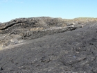 Exposed in the flank of a monocline are the Fisherman's Point Namurian deepwater sediments. Note the cut and fill of channeled Ross Formation. Channel fill overtops the channeling forming winged onlapping overbank sands.