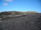 Exposed in the flank of a monocline are the Fisherman's Point Namurian deepwater sediments. Note the cut and fill of channeled Ross Formation. Channel fill overtops the channeling forming winged onlapping overbank sands.