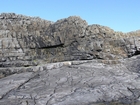 Fisherman's Point exposing Namurian deepwater sediments. Note the cut and fill of channeled Ross Formation on the flank of the coastal monocline.