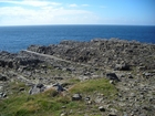 Just south of Fisherman's Point the deepwater sediments of Ross Formation rubble beneath turf.