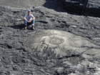 Exposures of a bedding plane surface in the Upper Carboniferous Ross Sandstone in which sand volcanoes overly local slumps of the deepwater sediment close to at Fisherman's Point. Volcanoes are built by sands transported by water released when the slide compacted beneath its own weight. Flank slopes reach 15° (Gill & Kuenen, 1958) with slightly concave outer slopes exhibiting flow runnels and ridges down the flanks with a central sand filledcrater (Strachen, 2002).