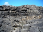 Fisherman's Point exposing Namurian deepwater sediments. Note the cut and fill of channeled Ross Formation on the flank of the coastal monocline.