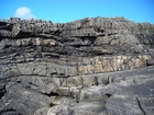 Fisherman's Point exposing Namurian deepwater sediments. Note the cut and fill of channeled Ross Formation on the flank of the coastal monocline.