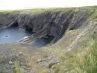 Monocline of Gull Island Formation composed of mixed channel sands and lobes and large deformational structures interpreted to have been transported downslope from a deltaic source above.