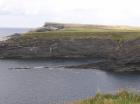 Gull Island Formation with solated turbidite-filled channels and large deformation structures signifying its slope origin.