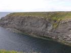 Gull Island Formation with solated turbidite-filled channels and large deformation structures signifying its slope origin.